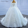 Robe de mariée perlée manches longues – CLEVI Paris