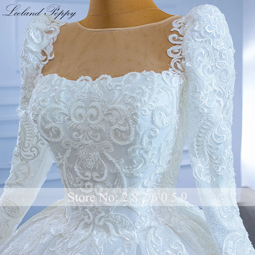 Robe de mariée perlée manches longues – CLEVI Paris