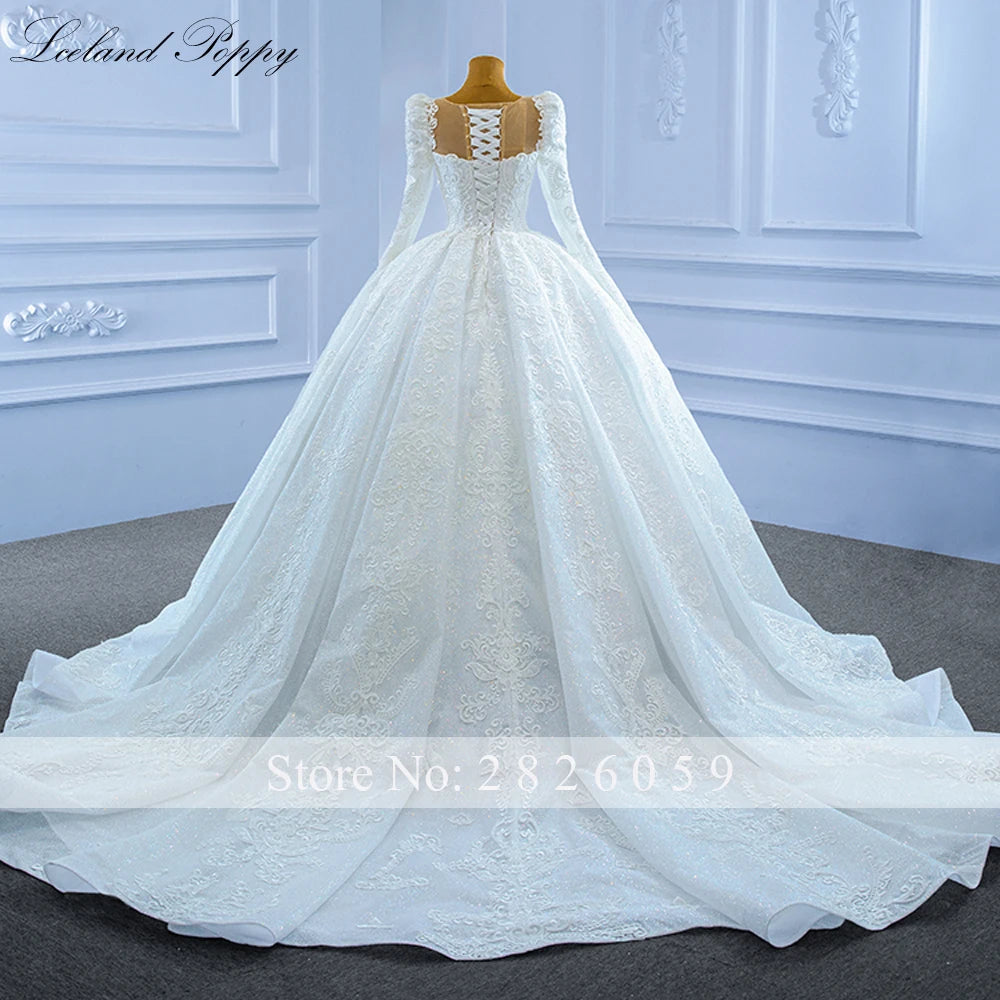 Robe de mariée perlée manches longues – CLEVI Paris