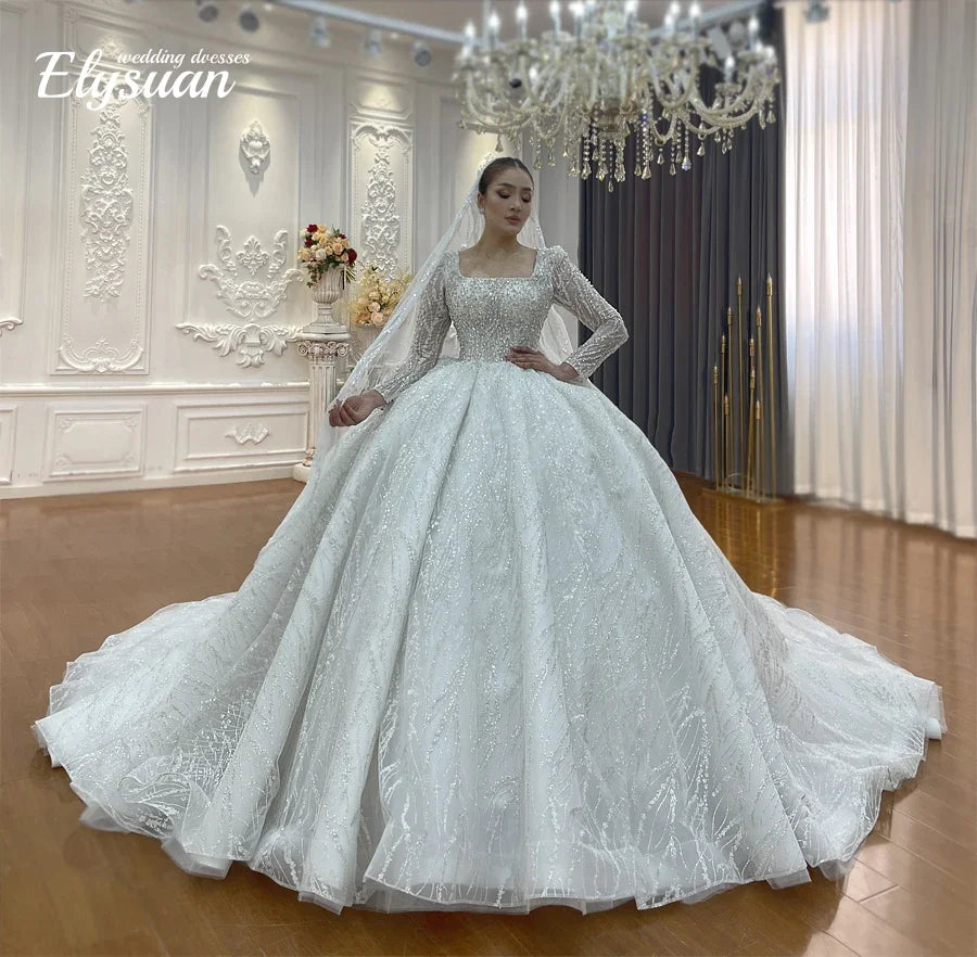 Robe de mariée en tulle et perles – CLEVI Paris