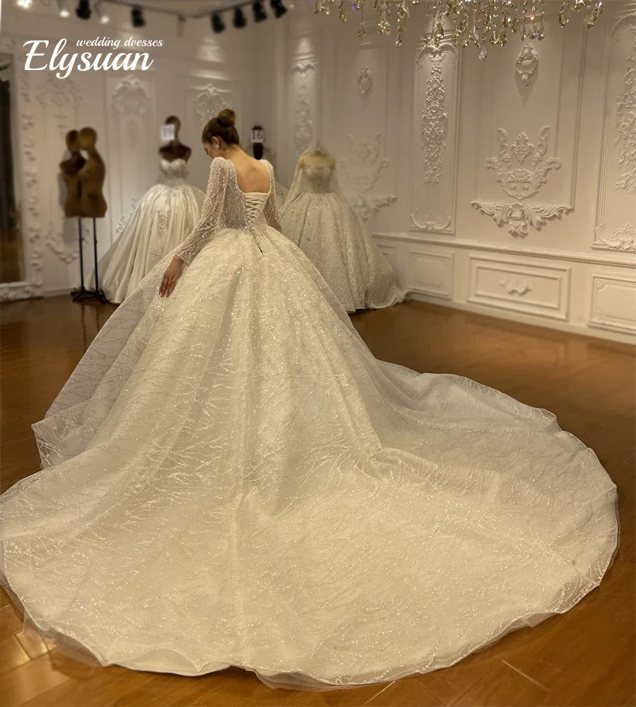 Robe de mariée en tulle et perles – CLEVI Paris