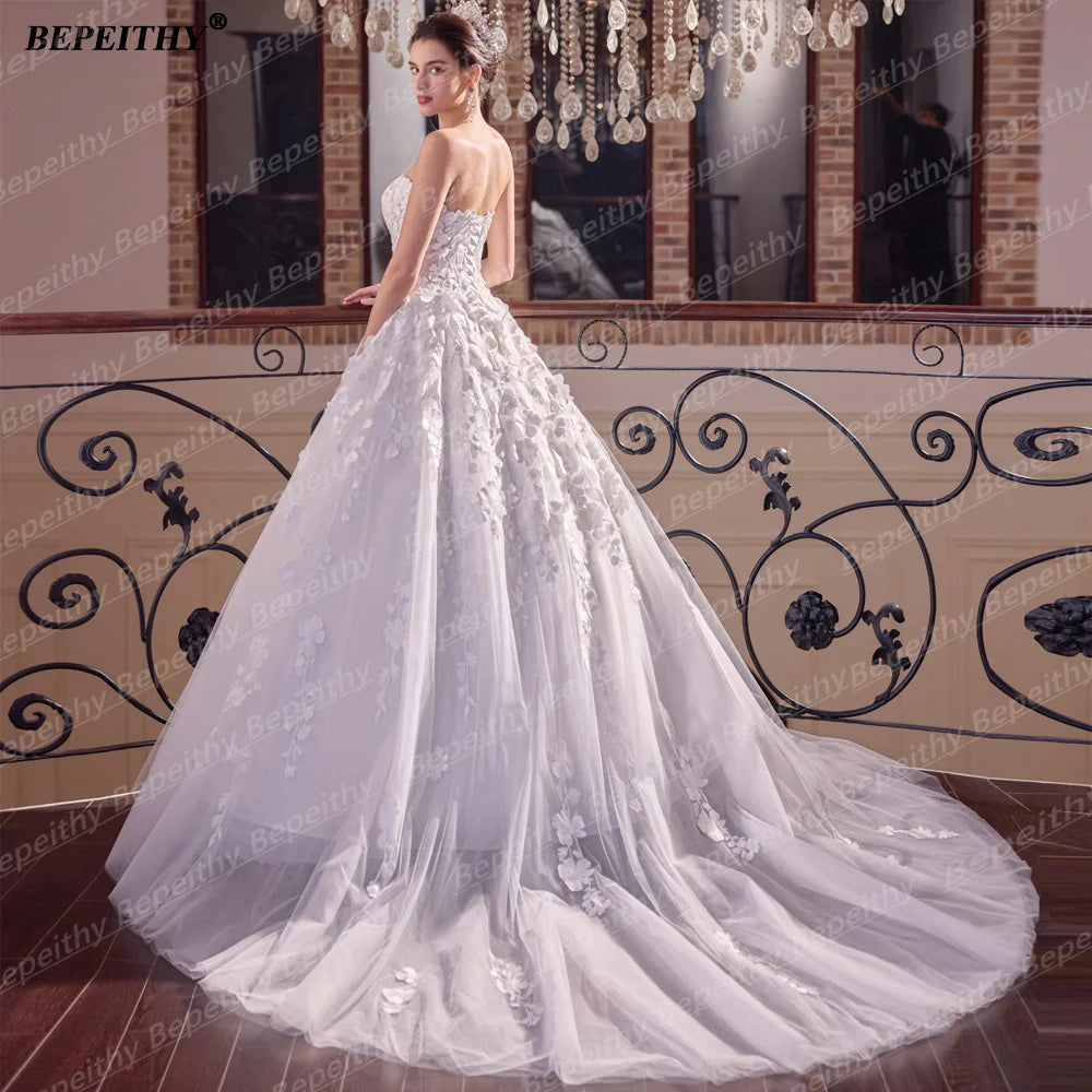 Robe de mariée bohème à fleurs – CLEVI Paris