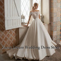 Robe de mariée satinée épaules dénudées – CLEVI Paris