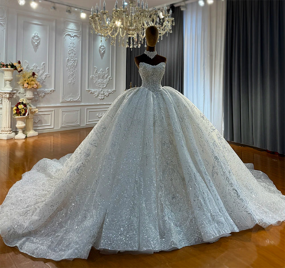Robe de mariée en tulle à manches longues – CLEVI Paris