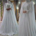 Robe de mariée en mousseline à col haut – CLEVI Paris