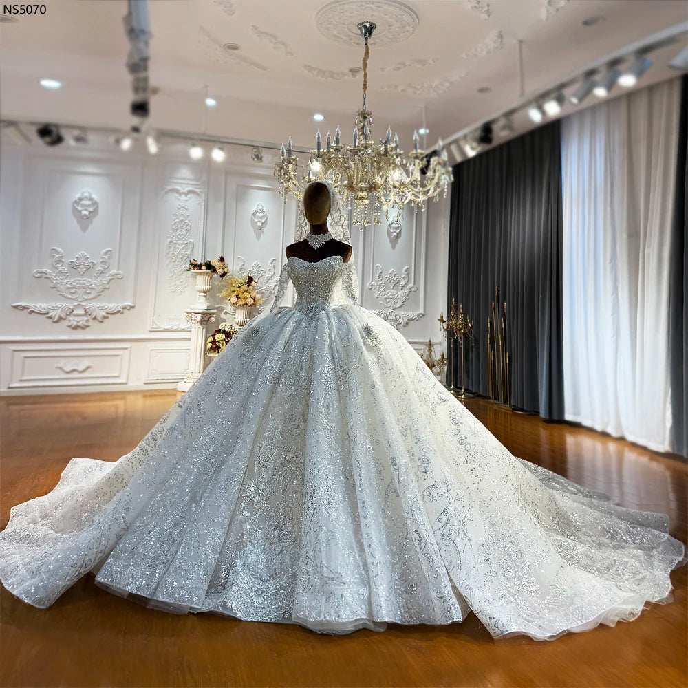 Robe de mariée en tulle à manches longues – CLEVI Paris