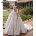 Robe de mariée satinée ligne A bustier – CLEVI Paris