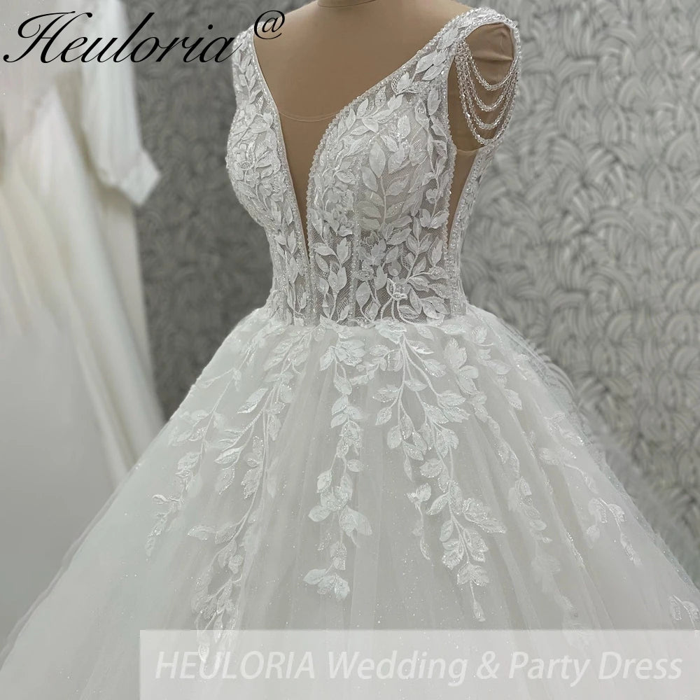 Robe de mariée ligne A en dentelle à perles – CLEVI Paris