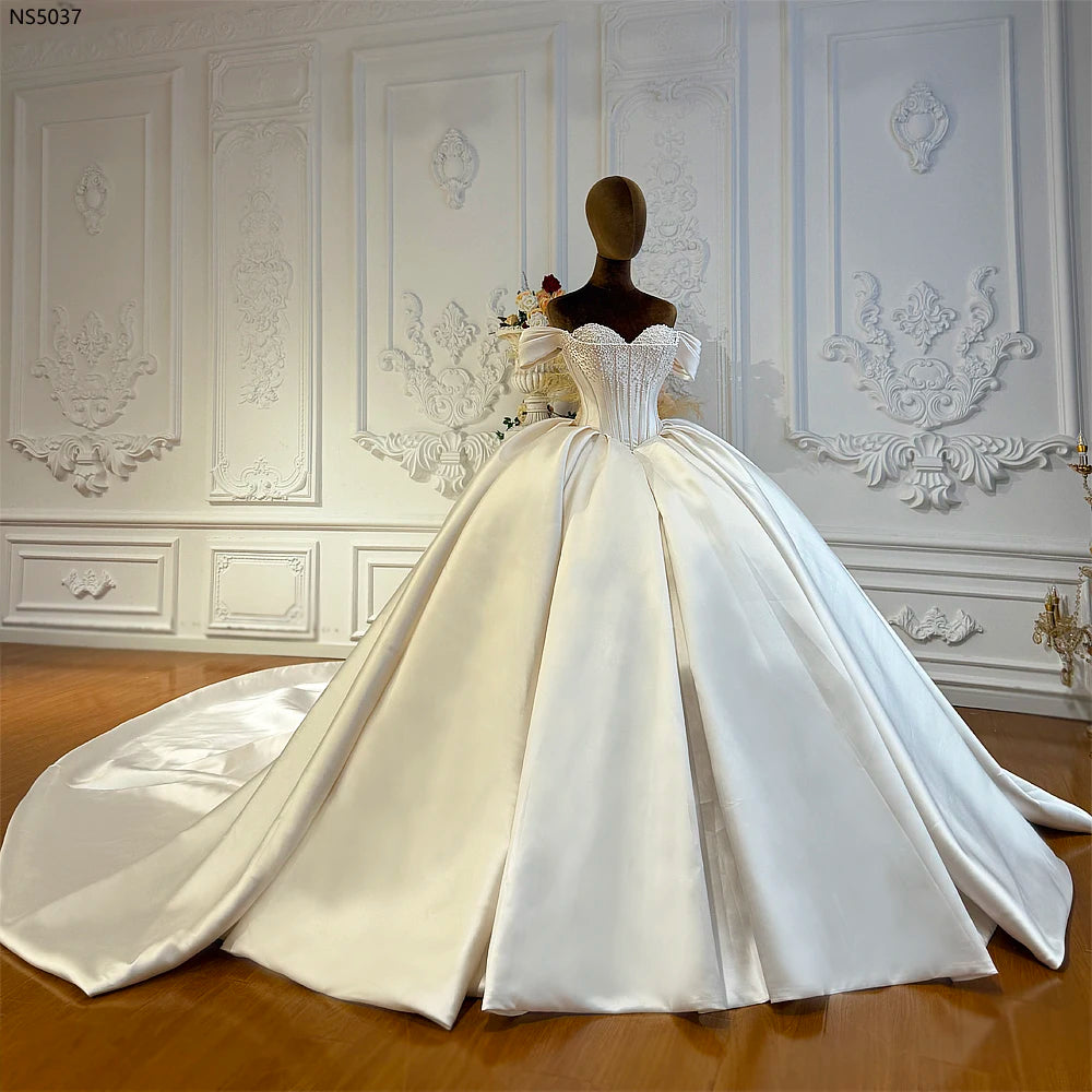 Robe de mariée fleurie en tulle – CLEVI Paris
