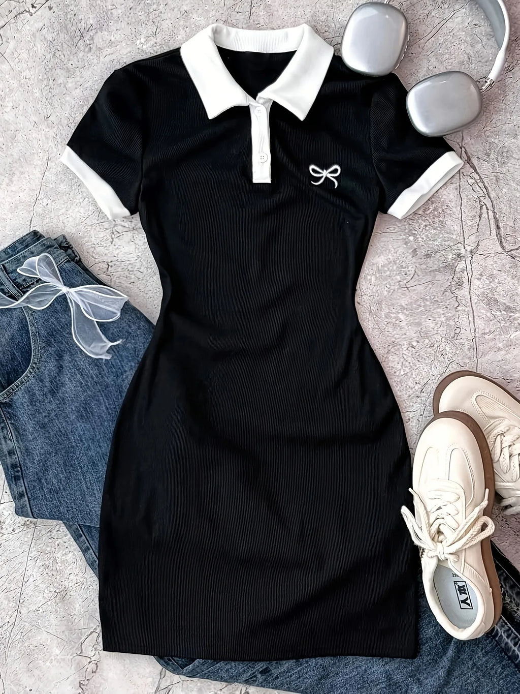 Robe polo fille en noire à motif nœud – CLEVI Paris
