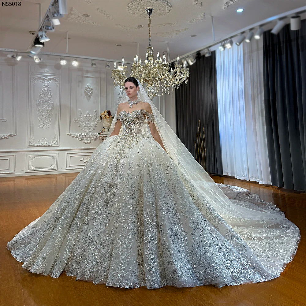Robe de mariée princesse en tulle fleuri – CLEVI Paris