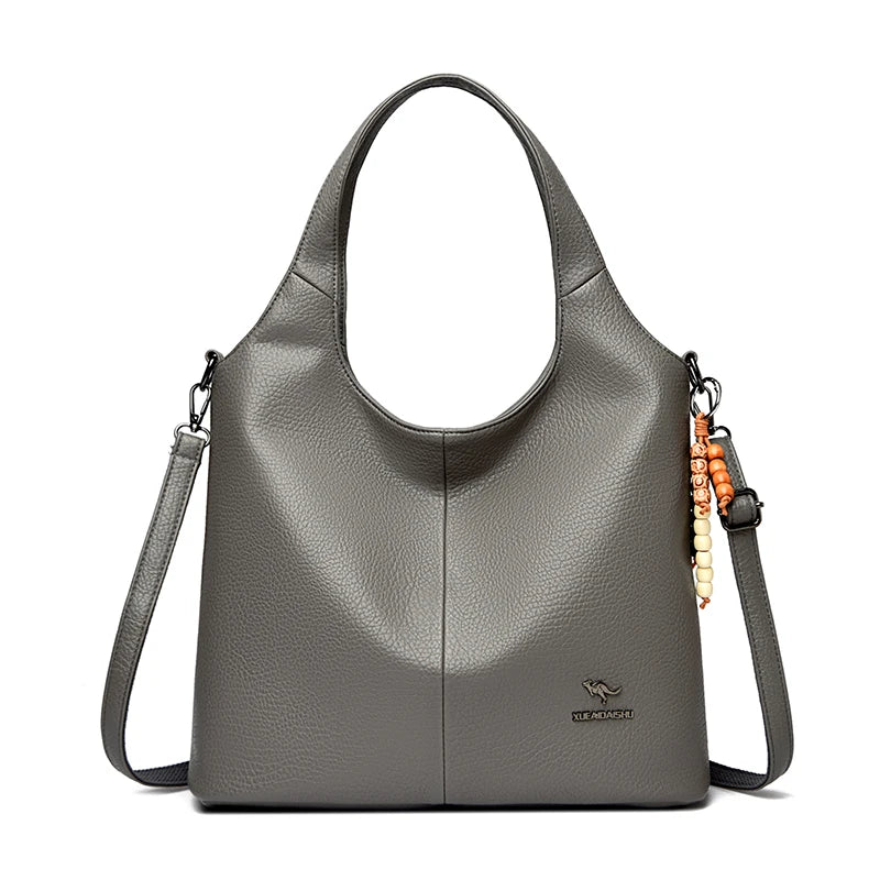 Sac seau femme souple à pompon – CLEVI Paris