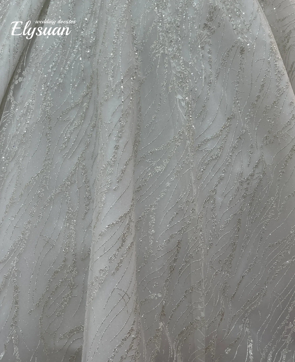 Robe de mariée en tulle et perles – CLEVI Paris