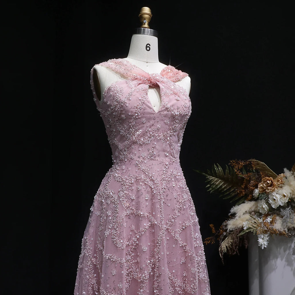 Robe de soirée trapèze perlée et croisée – CLEVI Paris