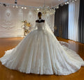 Robe de mariée fleurie col bateau – CLEVI Paris