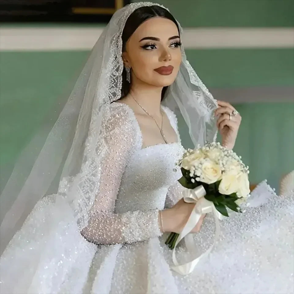 Robe de mariée trapèze perlée à dos ouvert – CLEVI Paris