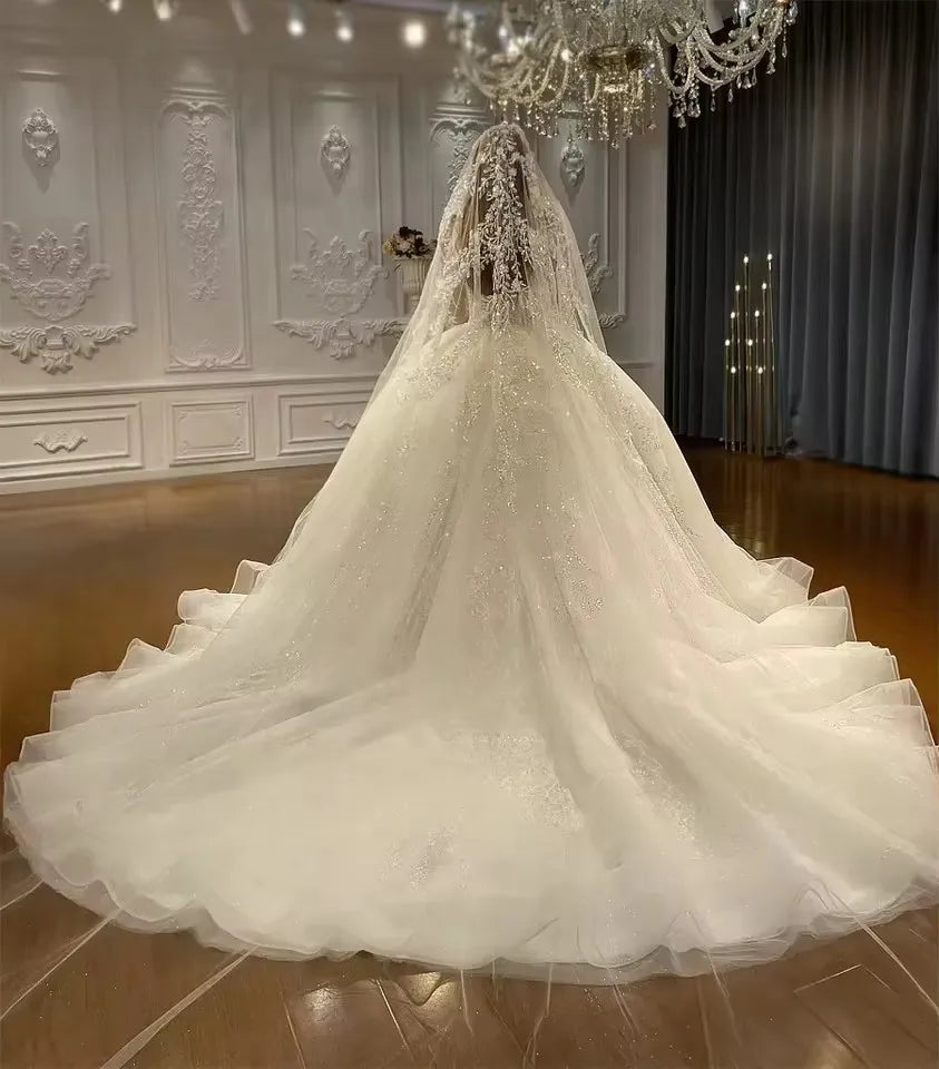 Robe de mariée perlée à manches longues – CLEVI Paris