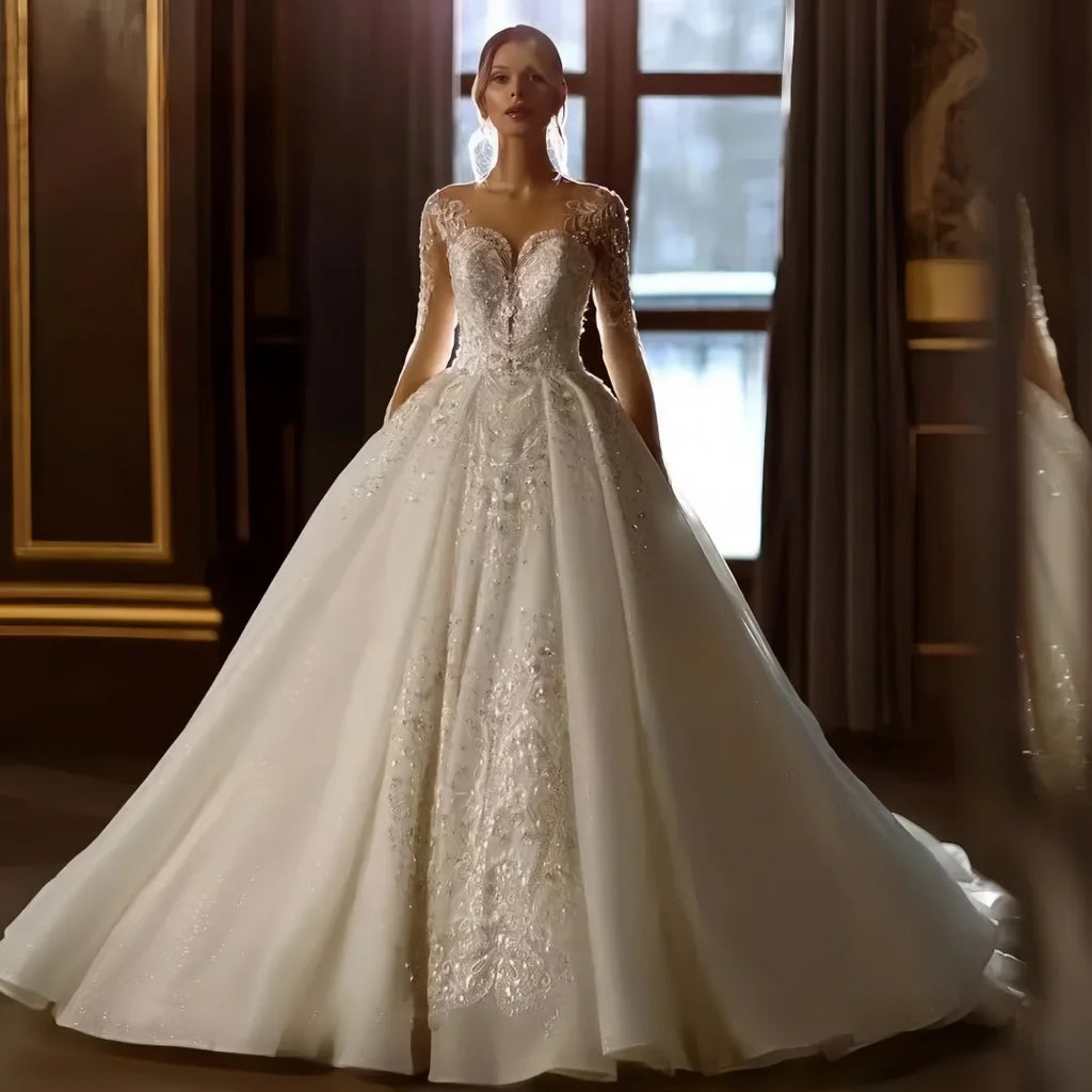 Robe de mariée dentelle et tulle, manches longues – CLEVI Paris
