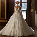 Robe de mariée dentelle et tulle, manches longues – CLEVI Paris