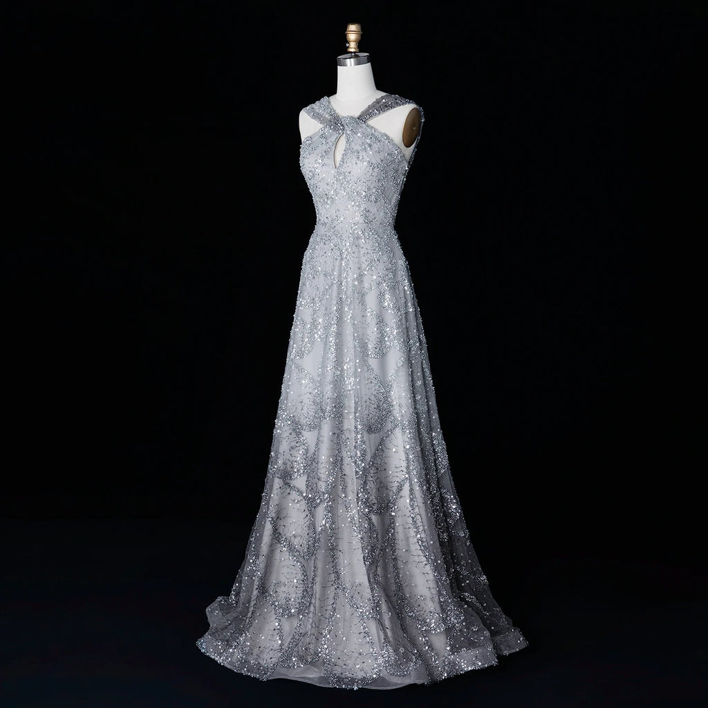Robe de soirée trapèze perlée et croisée – CLEVI Paris