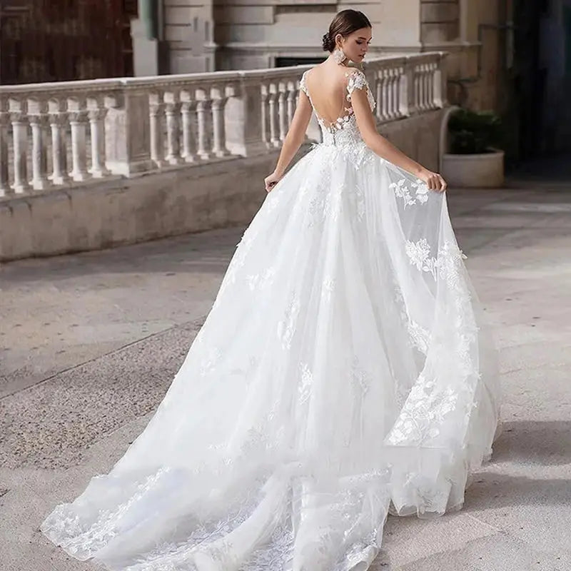 Robe de mariée trapèze manches courtes – CLEVI Paris