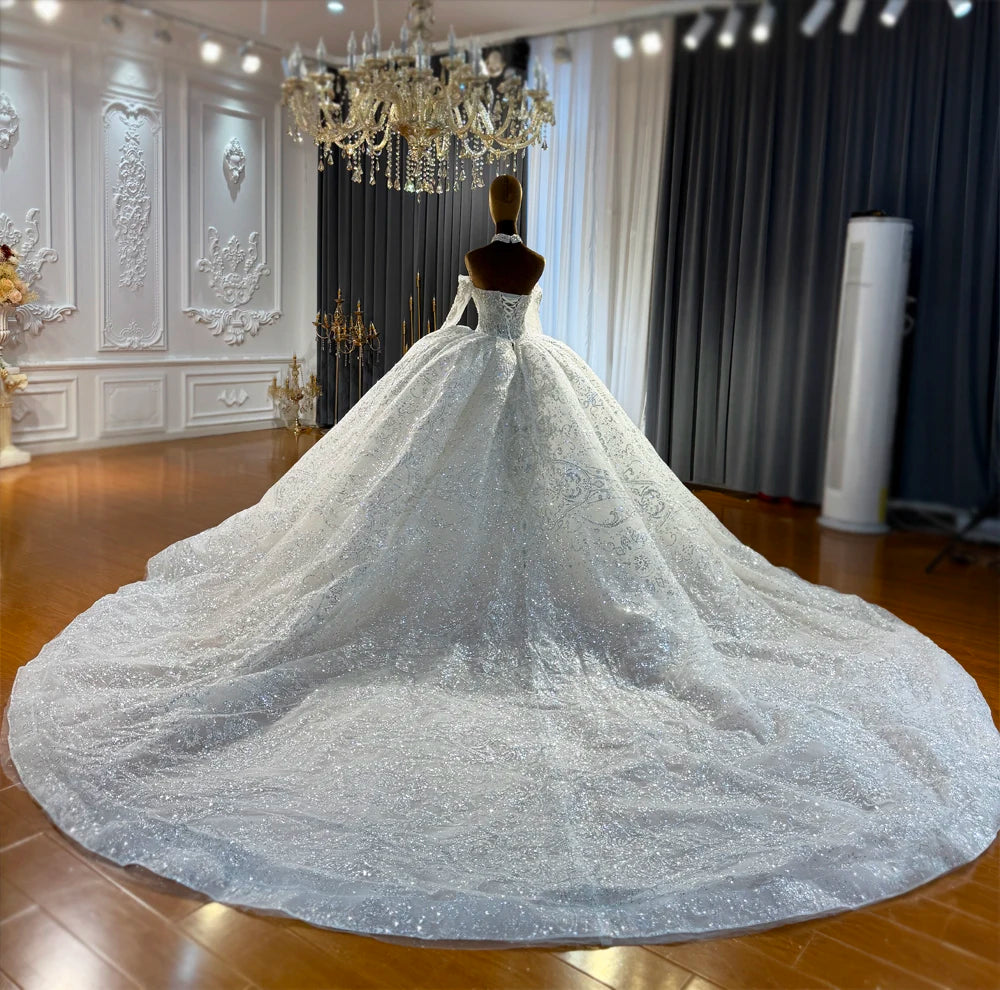 Robe de mariée en tulle à manches longues – CLEVI Paris