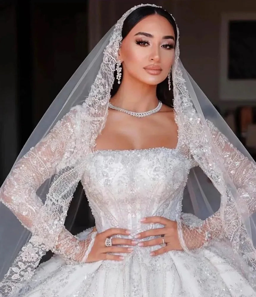 Robe de mariée princesse en tulle à manches longues – CLEVI Paris