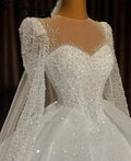 Robe de mariée en tulle perlé à col rond – CLEVI Paris
