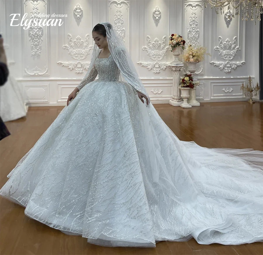 Robe de mariée en tulle et perles – CLEVI Paris