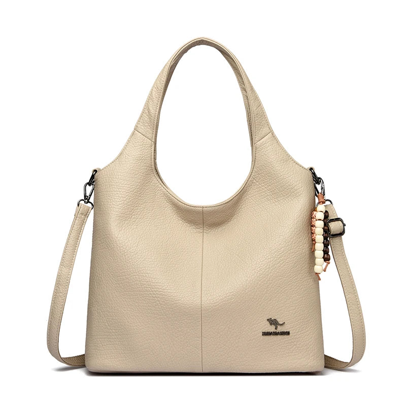 Sac seau femme souple à pompon – CLEVI Paris