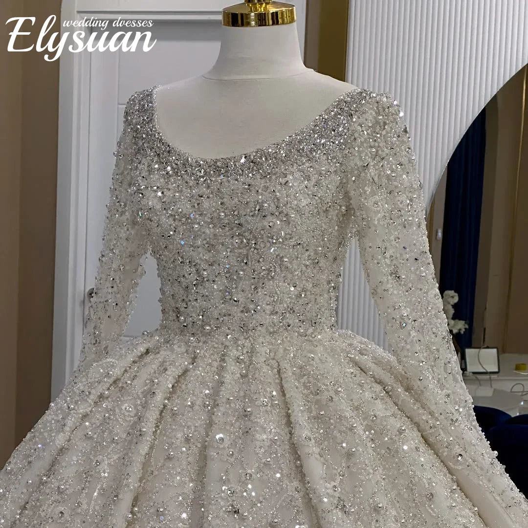 Robe de mariée princesse en tulle à manches longues – CLEVI Paris