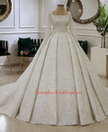 Robe de mariée col carré perlée – CLEVI Paris