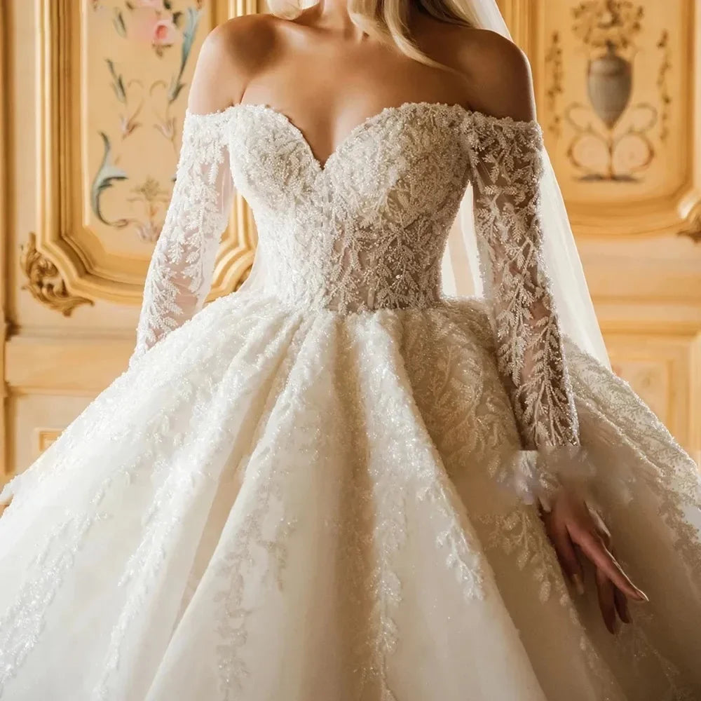 Robe de mariée en tulle brodé – CLEVI Paris