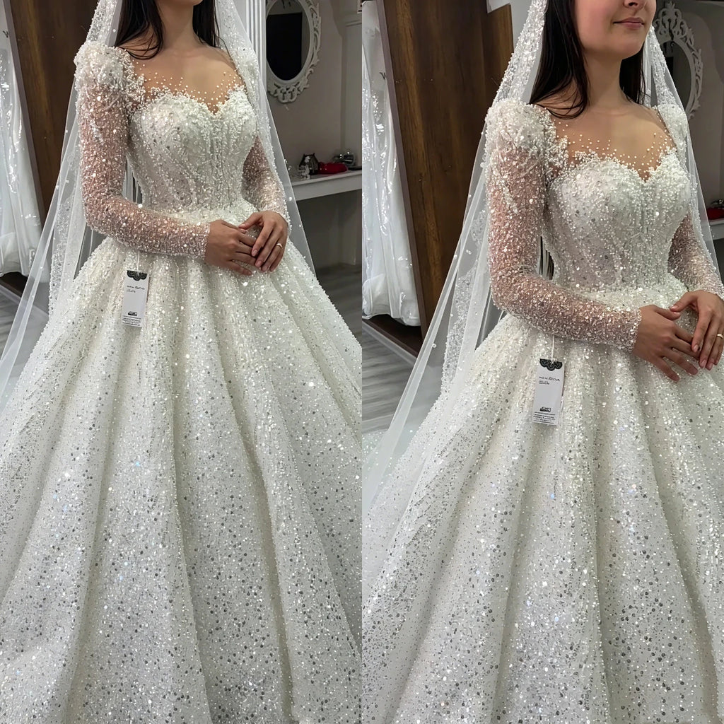 Robe de mariée dentelle perlée col V – CLEVI Paris