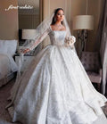 Robe de mariée princesse en tulle à manches longues – CLEVI Paris